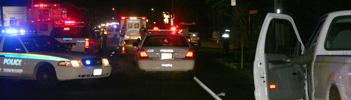 Police cars at the scene of a crime